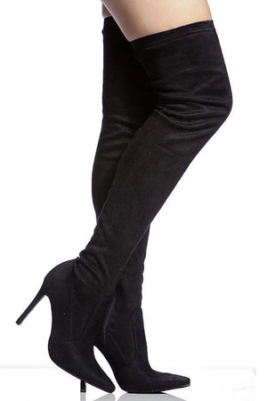 Gisele, Thigh high pointy black boots