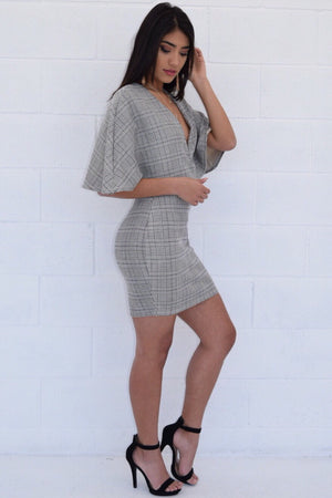 Tenley, Cape sleeve dress with plaid design and deep V neckline - Dimesi Boutique